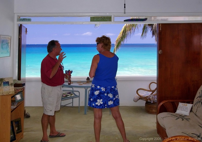 Malcolm Boyes and Nancy at Malcolm's "Chateau Relaxeau Caribe" on Little Apple Bay. The view looks like a painting!