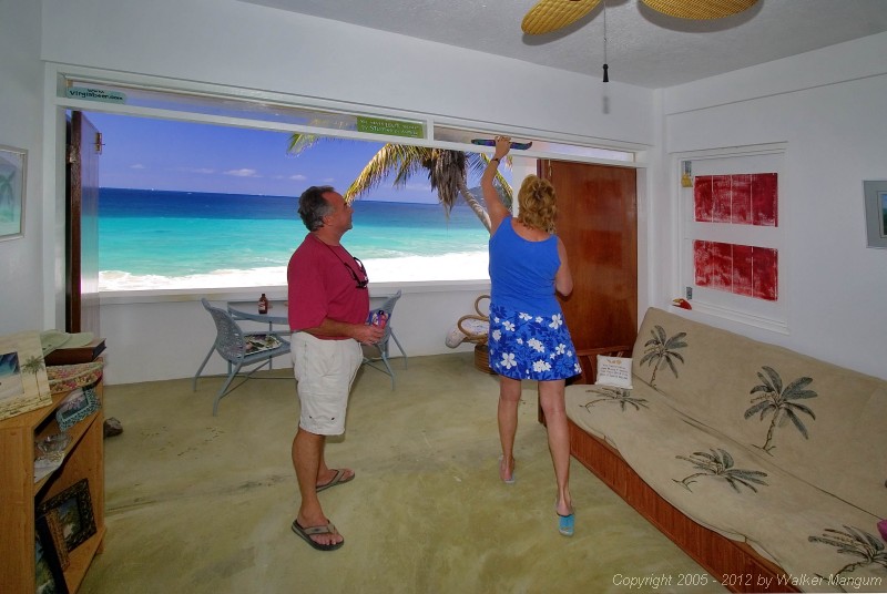 Malcolm Boyes and Nancy at Malcolm's "Chateau Relaxeau Caribe" on Little Apple Bay.  The view looks like a painting!