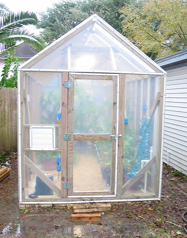 The new greenhouse -- built from scratch with the plans only in my head.  Just completed and plants inside!