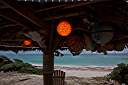 A little bit of island art. Fishing floats from the beach become palapa lights.
