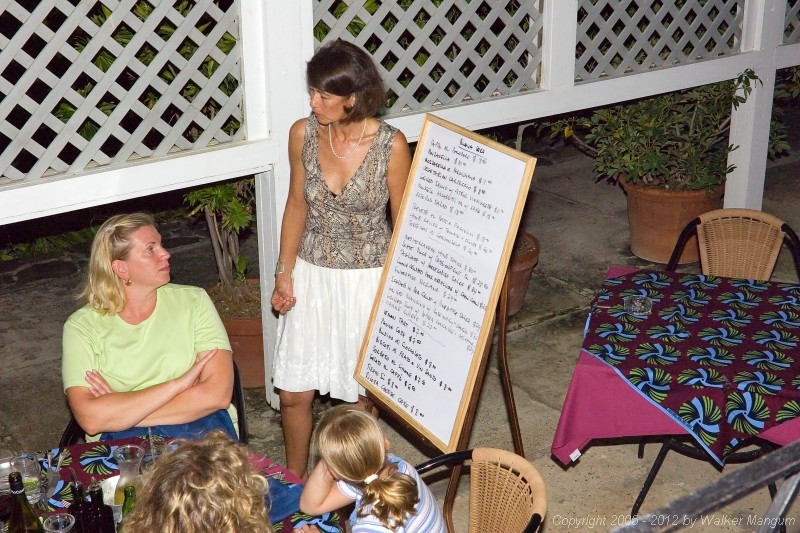 Cele showing the night's Brandywine Bay menu, using one of the two handmade wooden easels that Glenn Ashmore custom built as a gift to her and Davide.