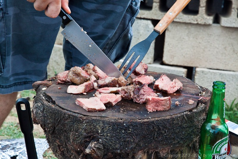 Slicing the goodies on top of a real thick cut slab of tree. This is how real men do it.