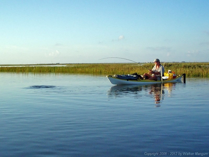The fish is still not ready for the net - and has swung my kayak around the pole.